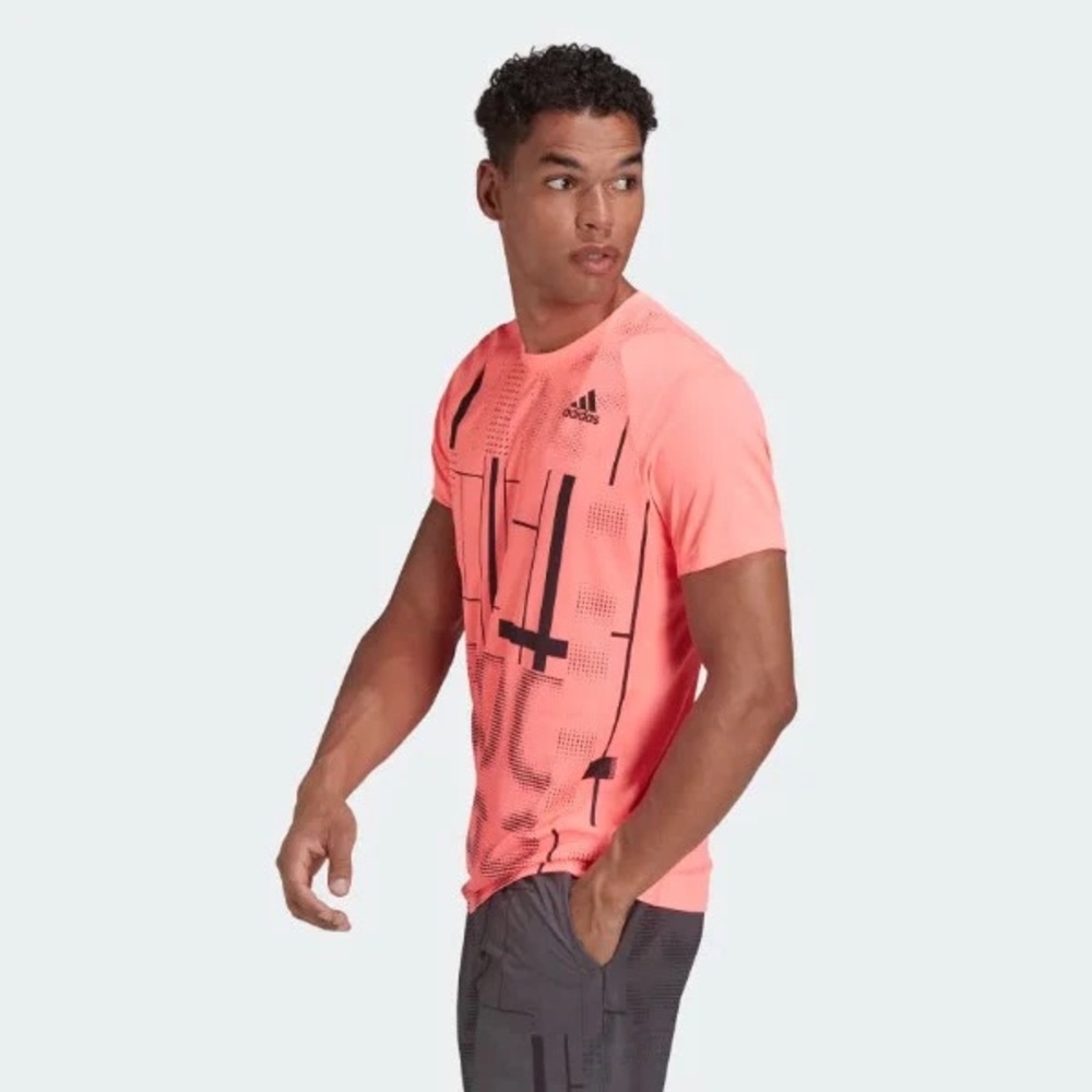 Men’s tennis short. Club graphic. Pinkish-orange. Dri-fit. Size small.